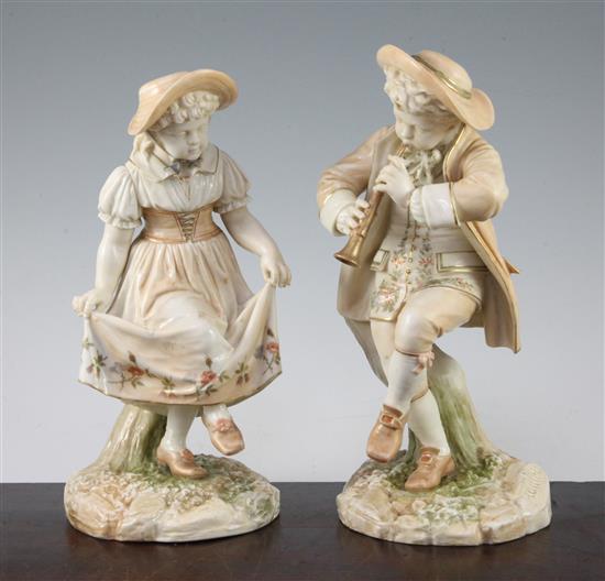 A pair of Royal Worcester blush ivory figures of Kate Greenway style children, modelled by James Hadley, 25.5cm and 24.5cm